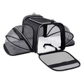 Black expandable pet carrier opened with breathable mesh extensions for travel waiting time