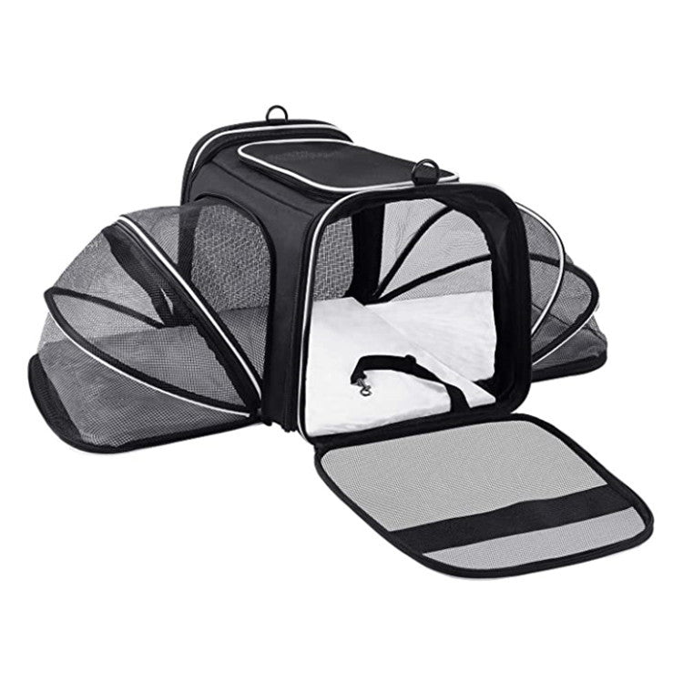 Black expandable pet carrier opened with breathable mesh extensions for travel waiting time