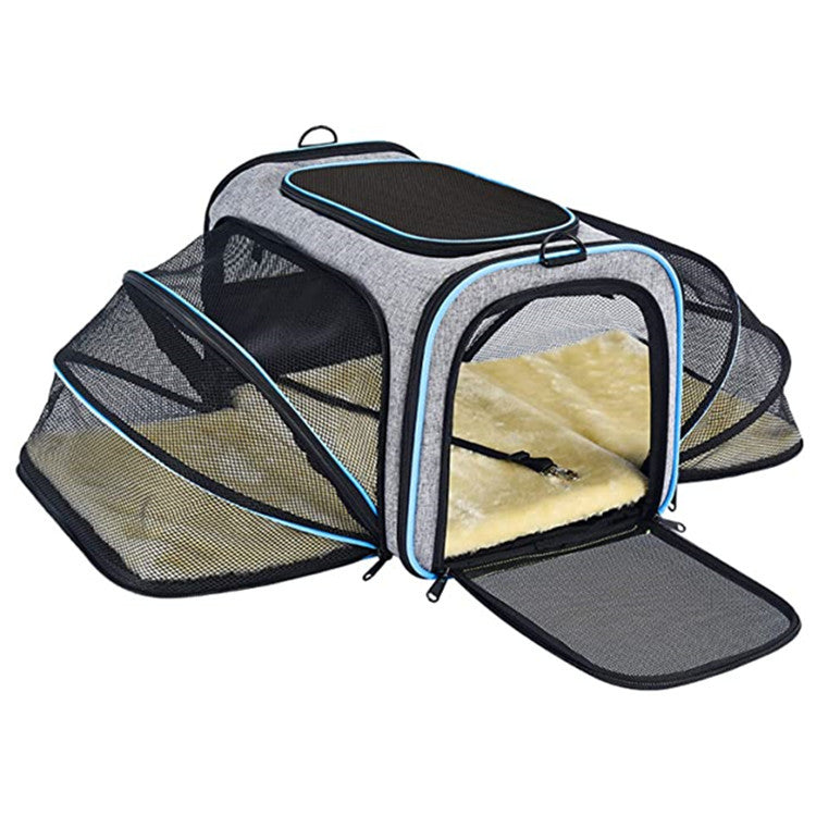 Blue expandable pet carrier opened with breathable mesh extensions for travel waiting time