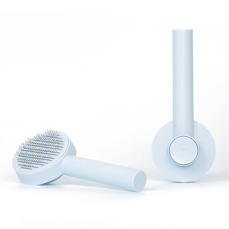 Self-cleaning pet brush for removing loose dog and cat fur during home grooming - Blue