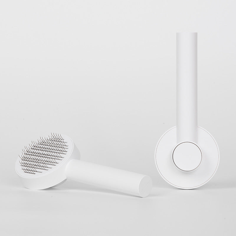 Self-cleaning pet brush for removing loose dog and cat fur during home grooming - White